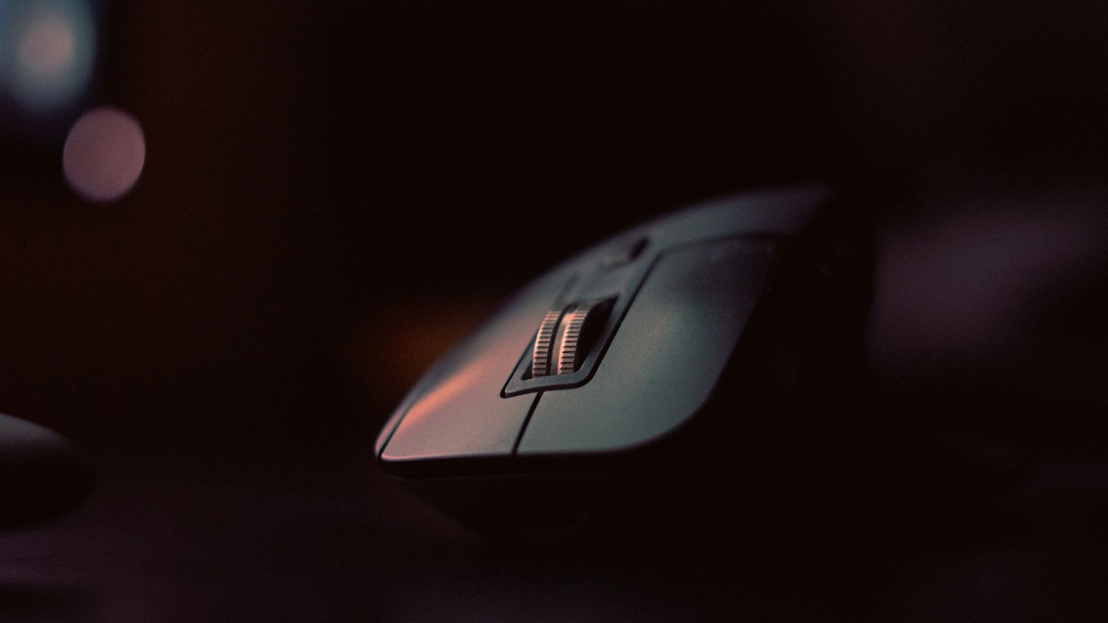 Detailed shot of a hand demonstrating proper neutral grip on a vertical mouse.