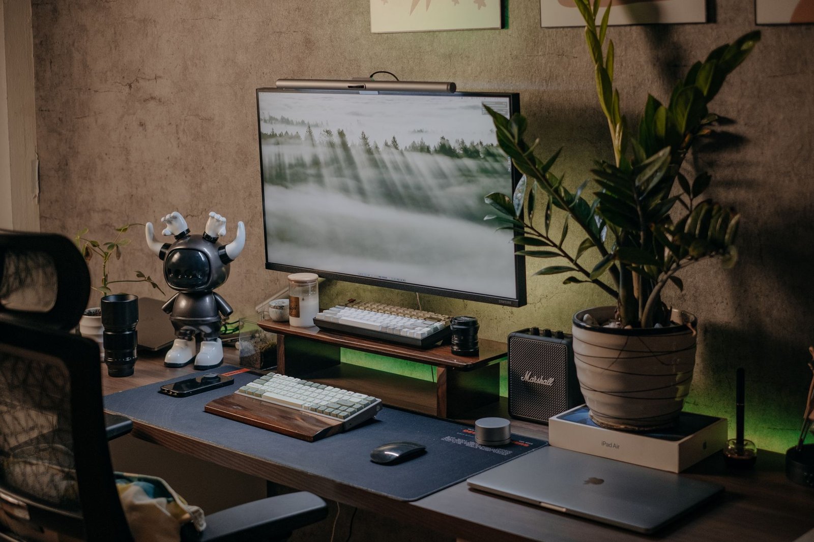 A clean desk with an e-ink display and silent smartphone.