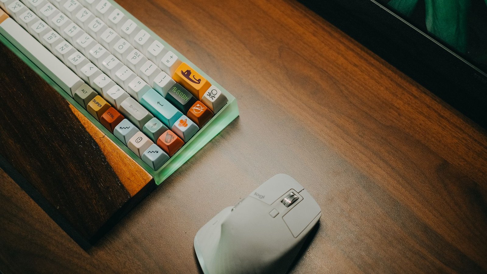 Clean minimalist desk layout featuring an ergonomic keyboard and vertical mouse.
