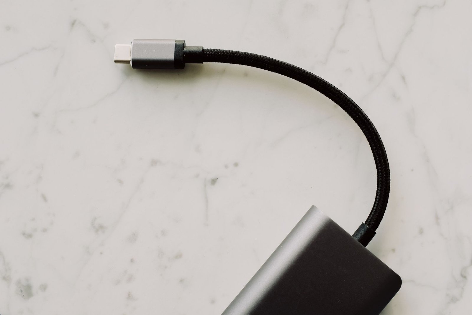 Close-up of USB-C cable connectors showing reinforced strain relief and wiring.