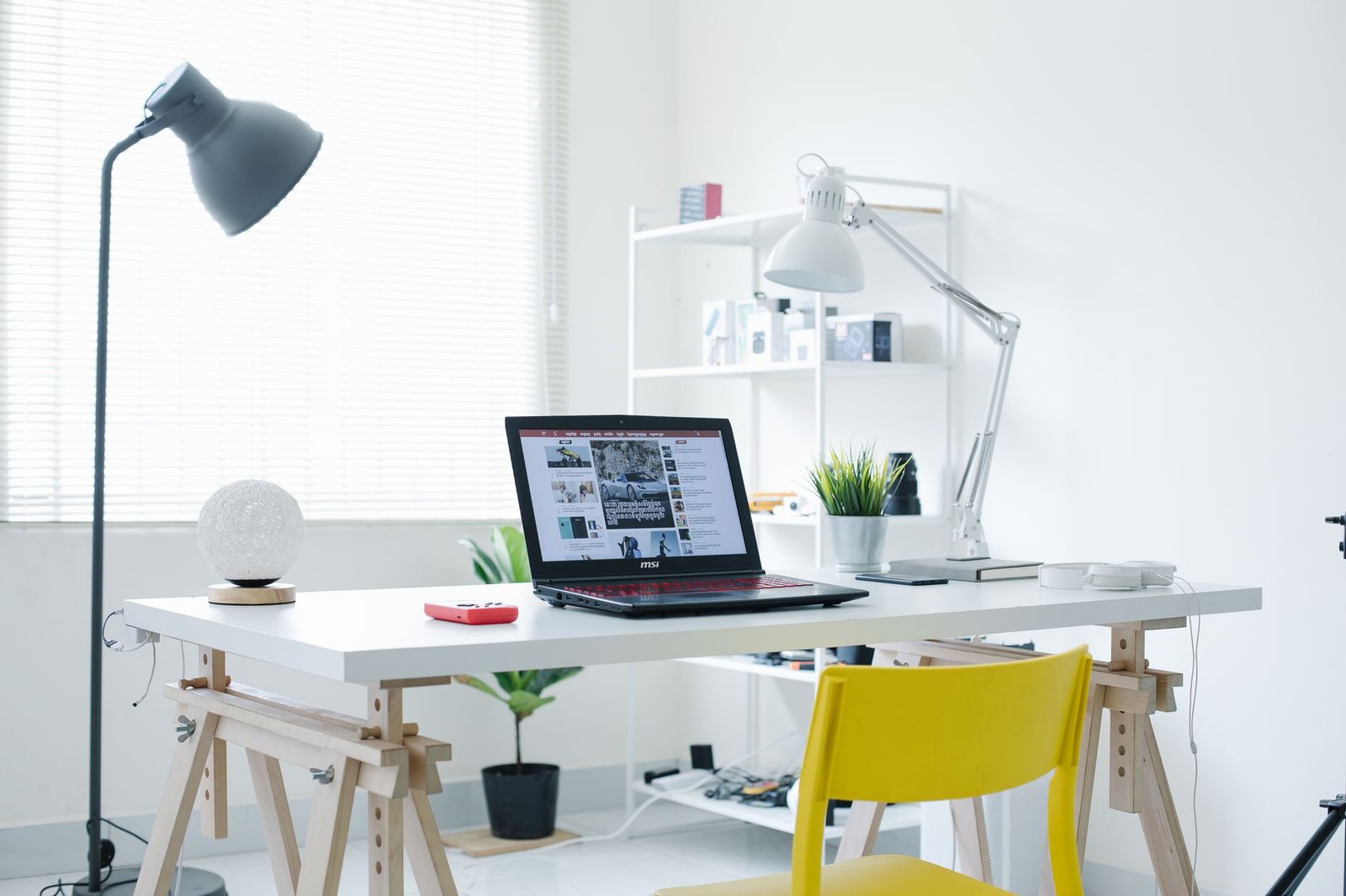 A clean desk lamp illuminating a workspace with warm ambient light.