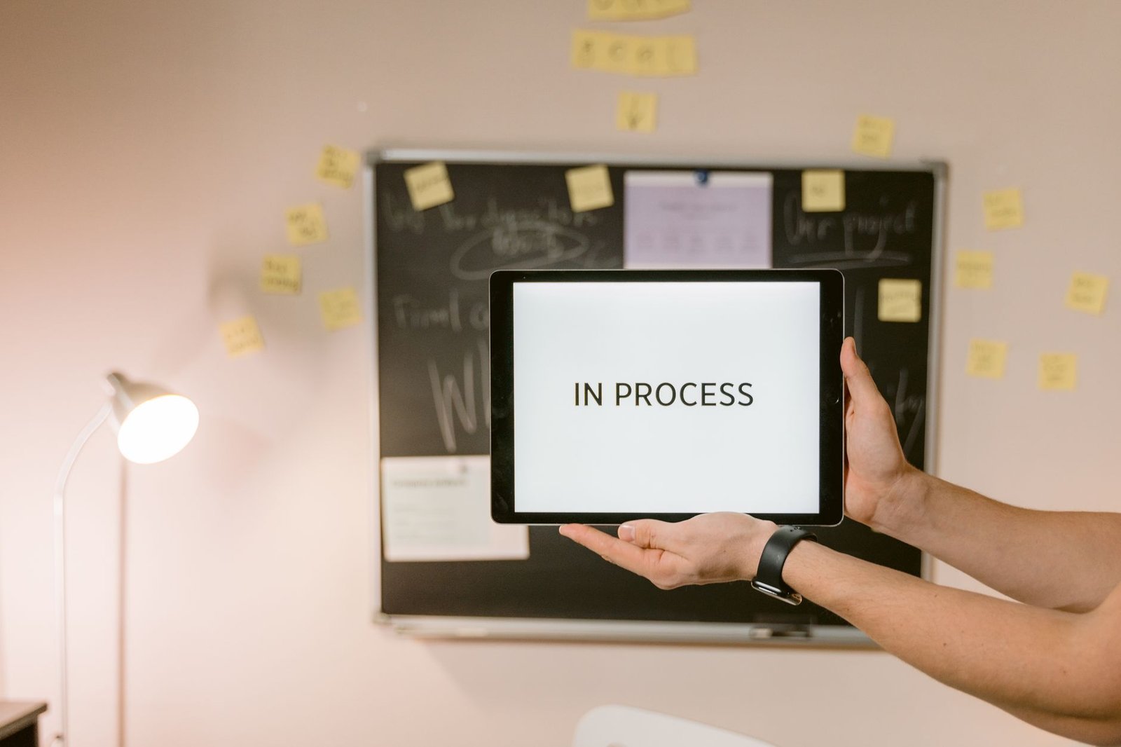 Sleek tablet displaying an advanced project management timeline in a bright room.