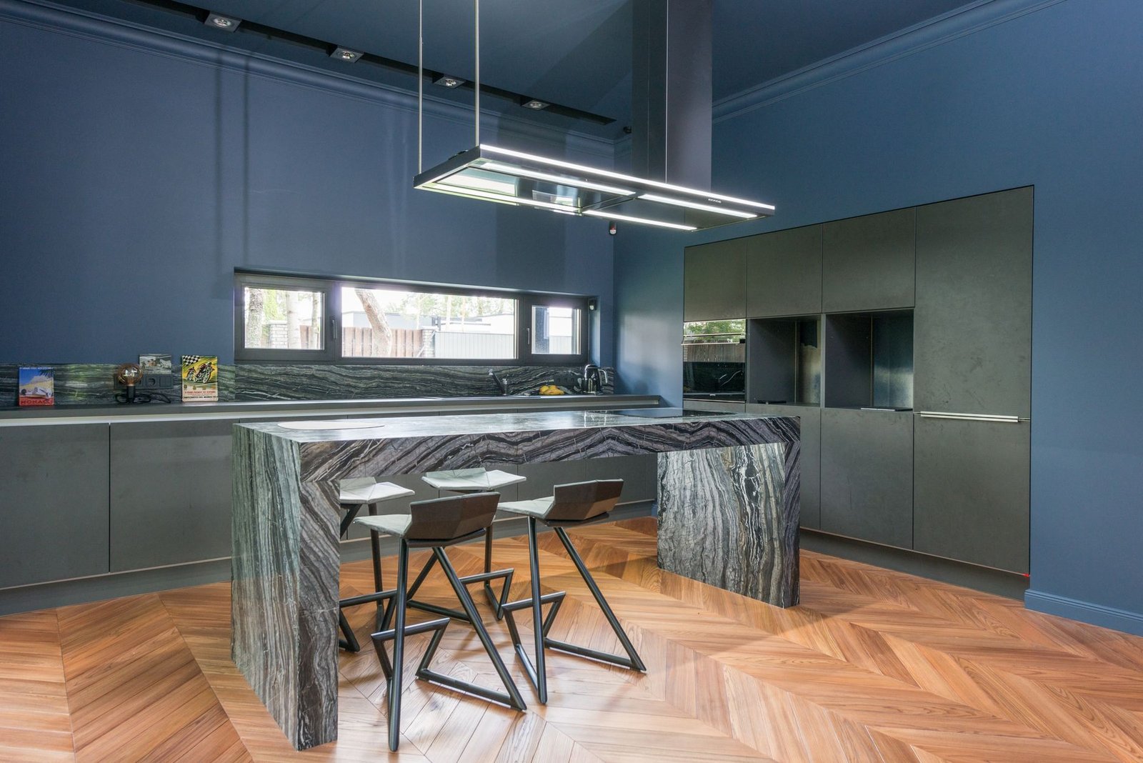 Clean, bright modern kitchen interior with minimalist white cabinetry and natural light.