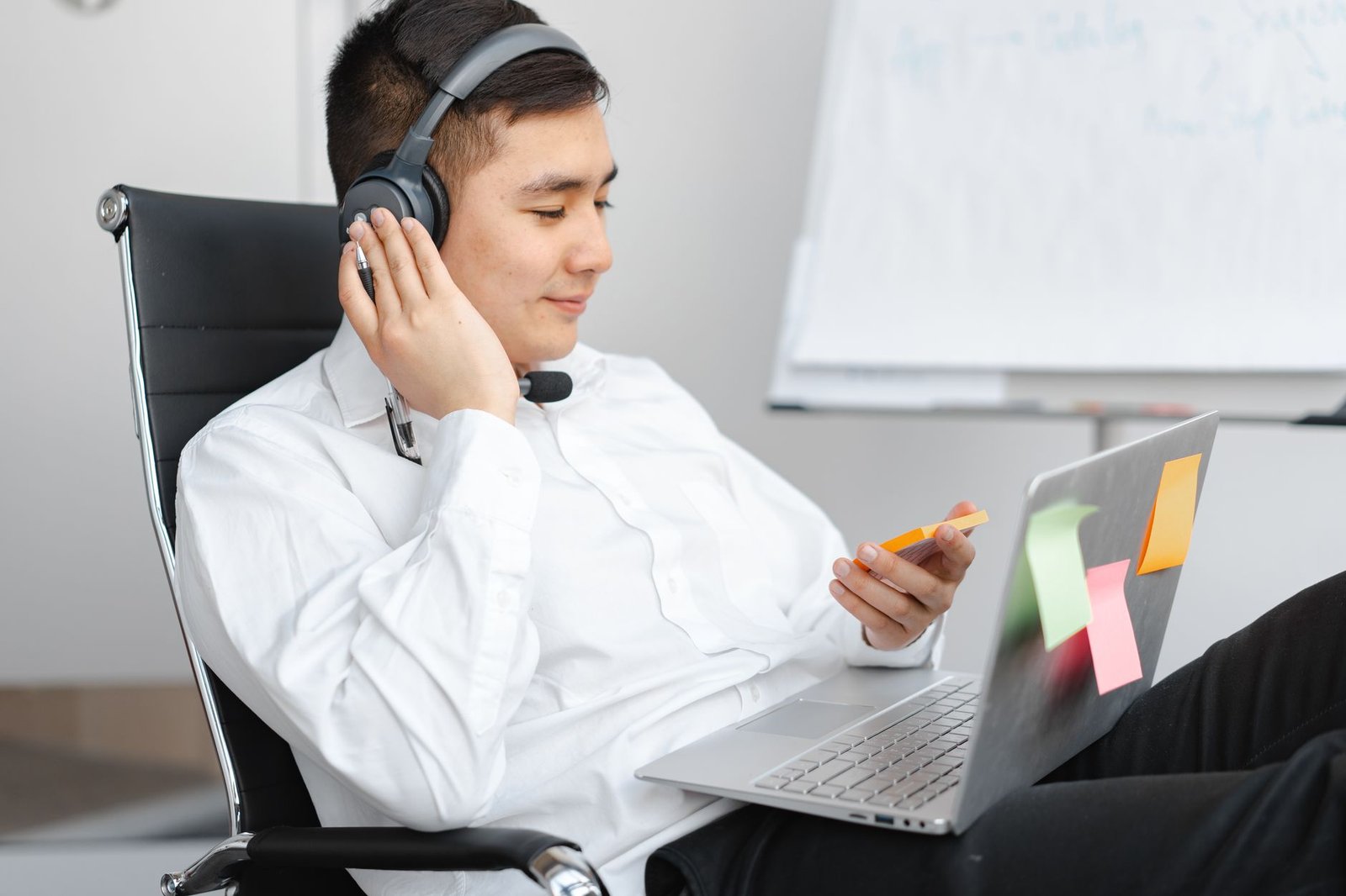 Professional focused remotely while wearing advanced over-ear noise-cancelling headphones.