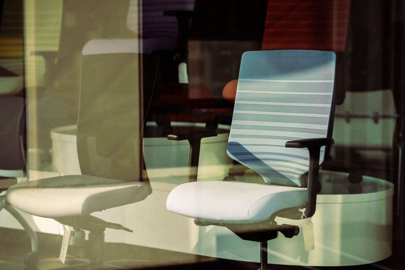 Modern ergonomic chair reclined in a minimalist home office.