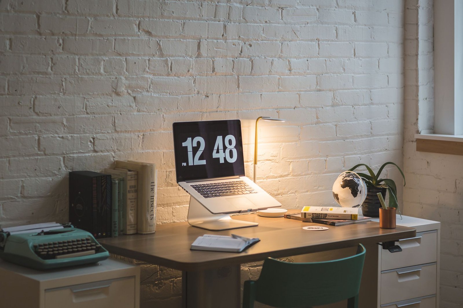 A clean, minimalist home office desk set up for deep focused work.