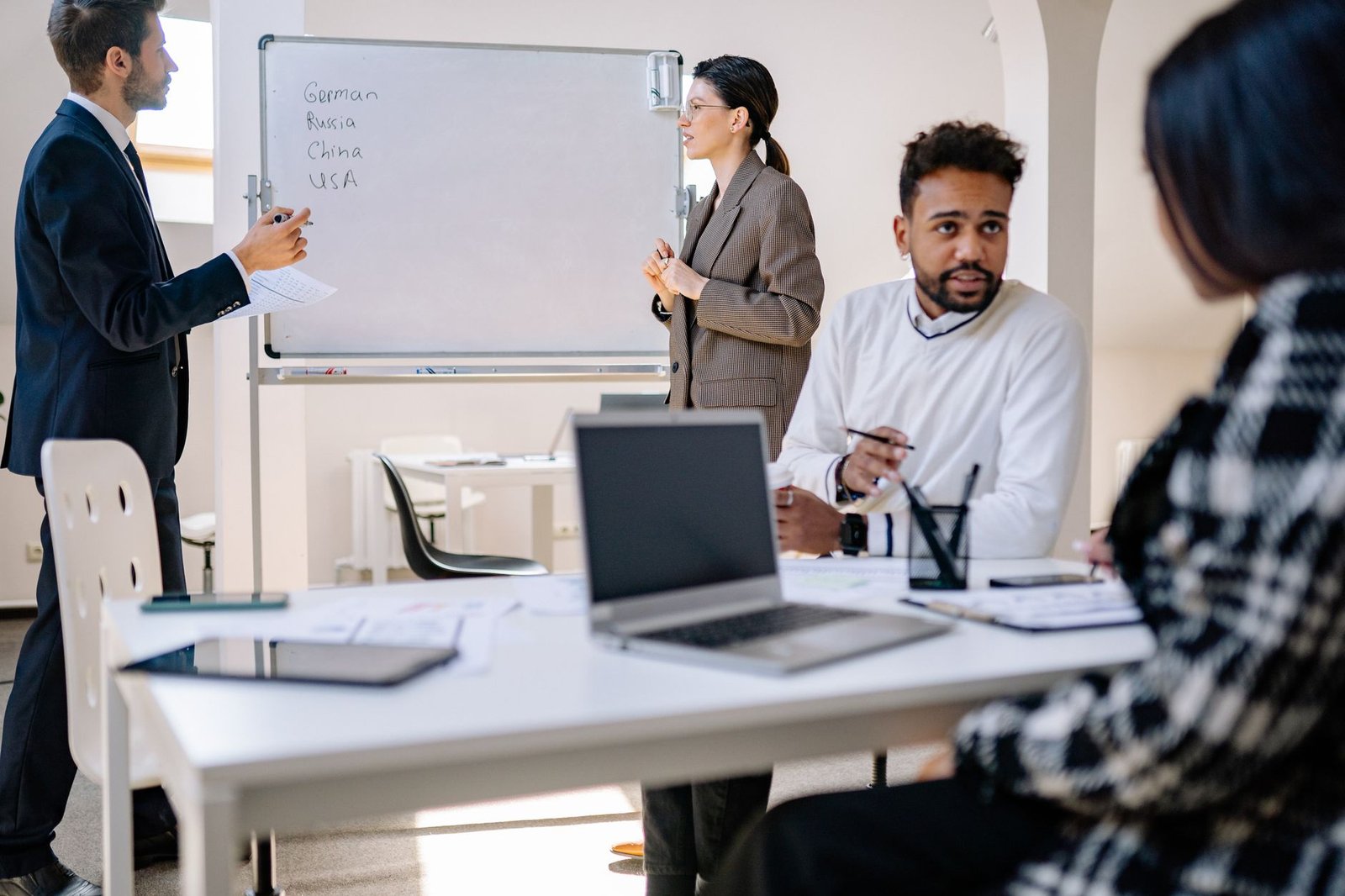 Modern collaborative office environment with professionals engaged in structured planning.