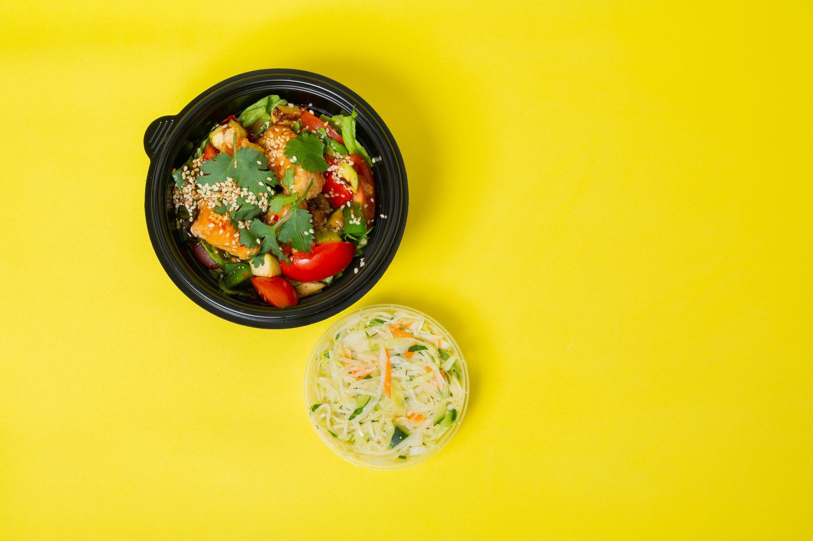 A colorful balanced lunch bowl with fresh greens and proteins.